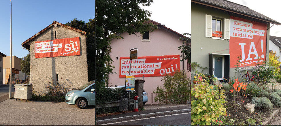 Beispiele von grossen Konzernverantwortungs-Bannern an Hausfassaden
